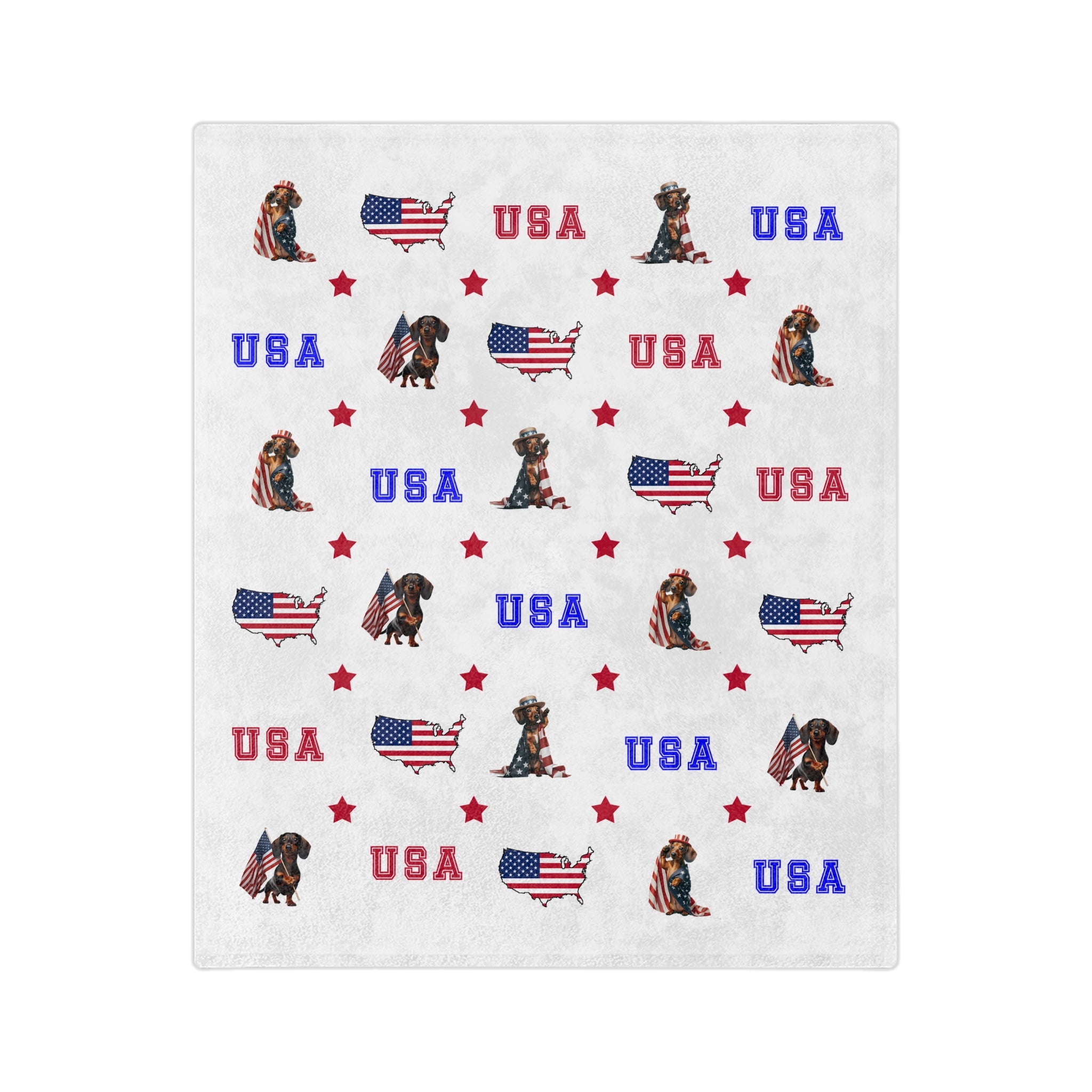White velveteen balnket with red, white, and blue USA-themed designs including dogs and flags.