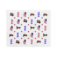 White velveteen balnket with red, white, and blue USA-themed designs including dogs and flags.