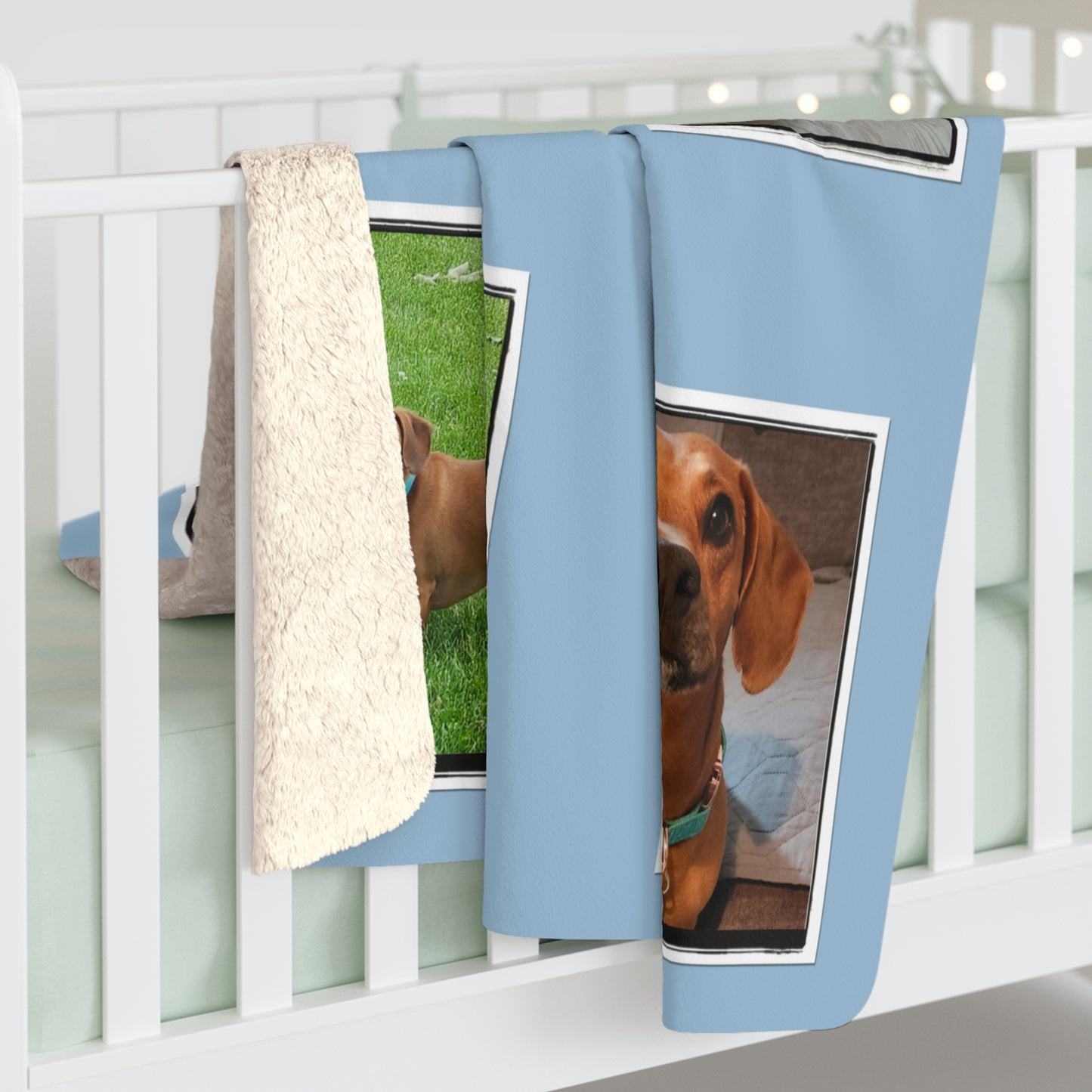 Blue blanket with dog prints hanging on a white rack.