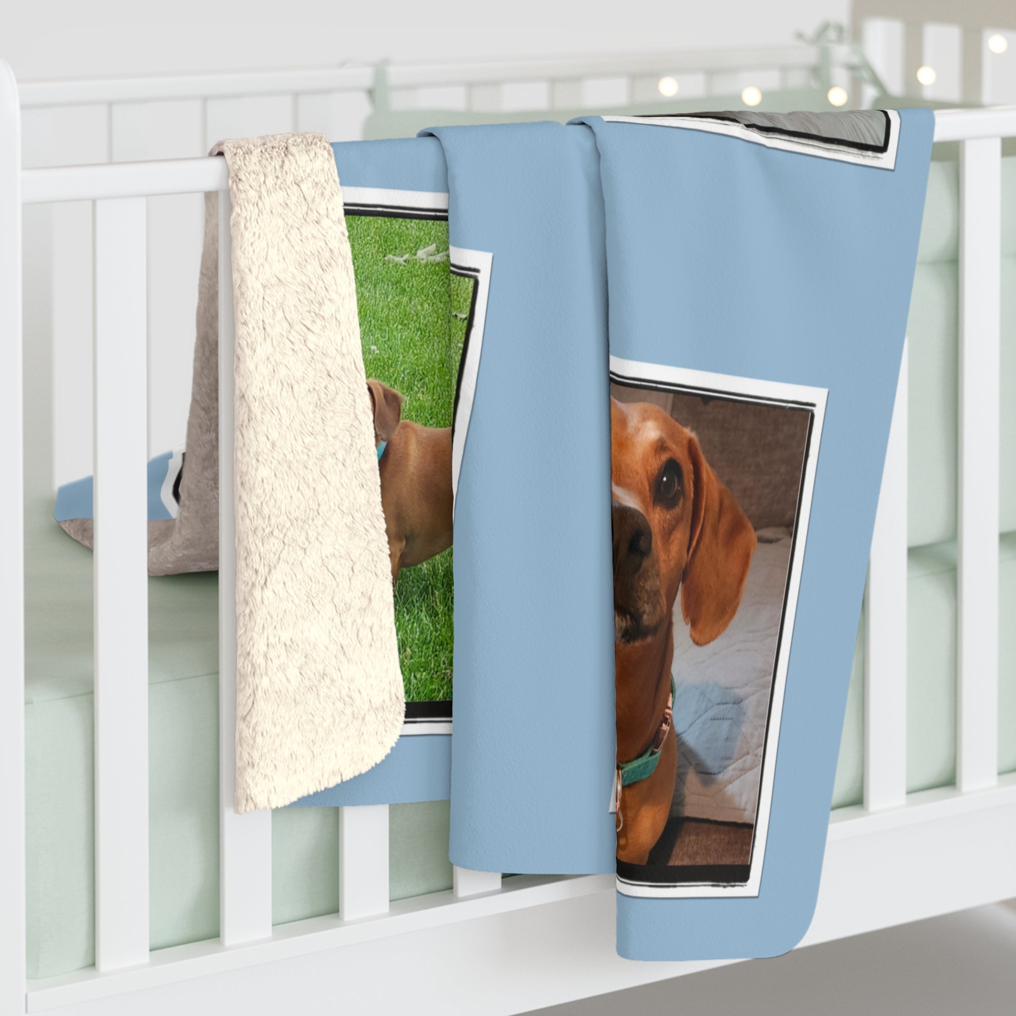 Blue blanket with dog prints hanging on a white rack.