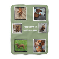 Green blanket with images of a dog and text 'Property of the Wiener Crew' on a white background