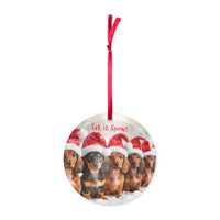 round acrylic Christmas ornament with dachshunds in Santa hats