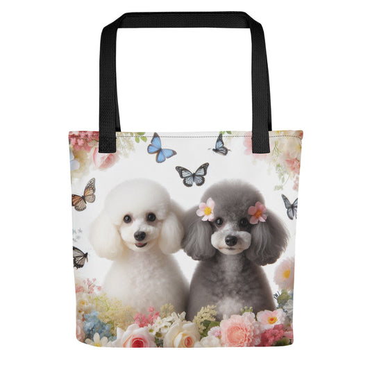 2 miniature poodles with folowers and butterflies on a tote bag