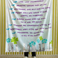 A blanket with text that lists qualities of a devoted dachshund mom, decorated with illustrations of dachshunds, flowers, and a fence.